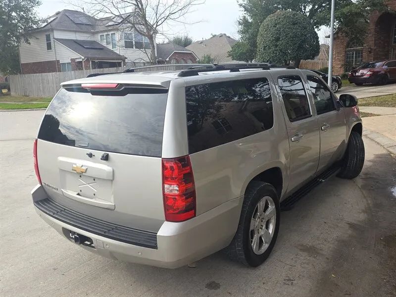Silver 2007 Chevrolet Suburban 1500 LTZ rear side photo near Houston TX