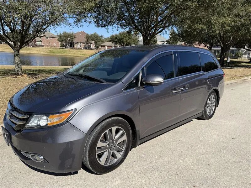 Gray 2015 Honda Odyssey Touring Elite front angle near Houston TX