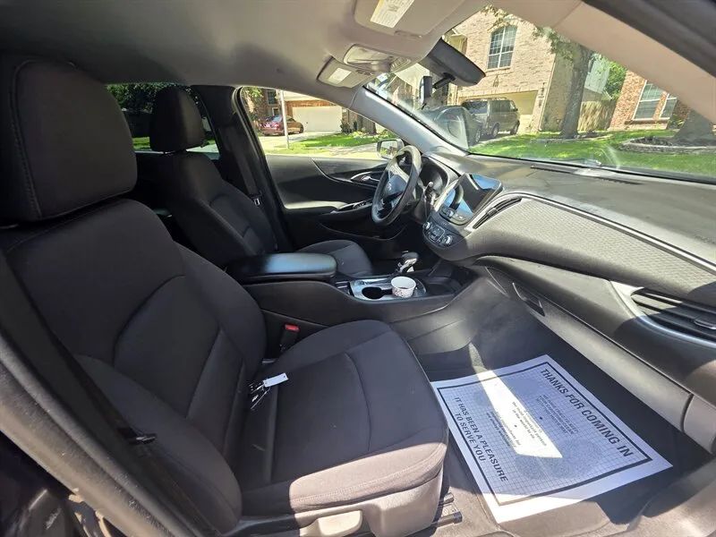 Used sedan front cabin example for Nissan Altima trim and comfort comparison near Houston TX