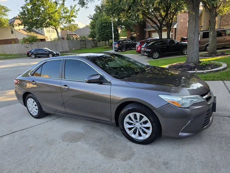 Gray Toyota Camry front angle photo near Houston TX