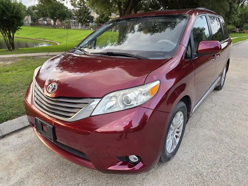 Red 2013 Toyota Sienna XLE front angle near Houston TX